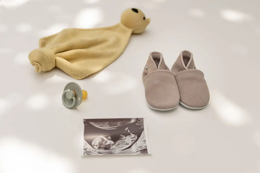 Van slofjes tot eerste stapjes Bescherming, comfort en liefde voor kleine voetjes